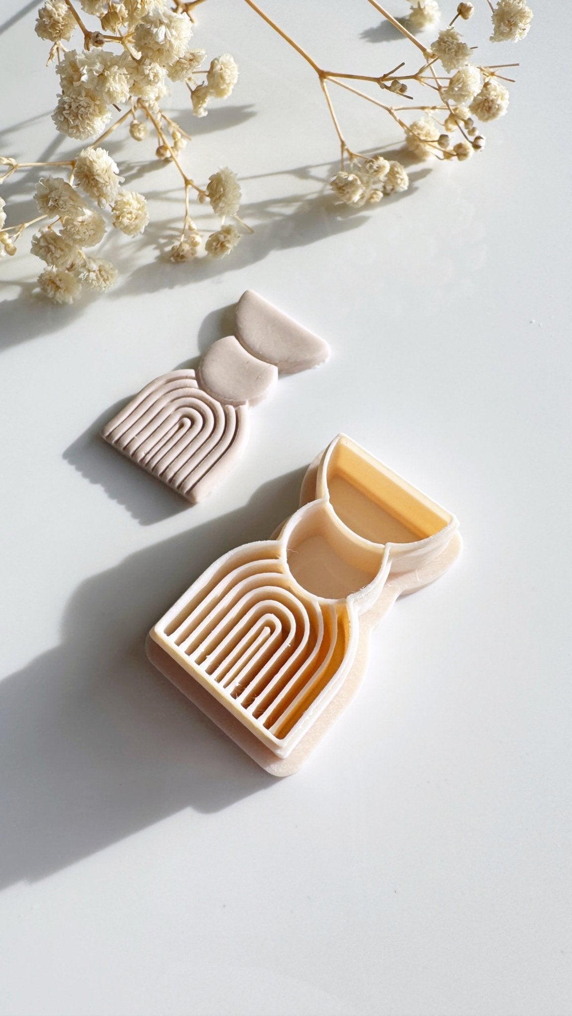 Embossed arch and stud cutter - Goat Corp